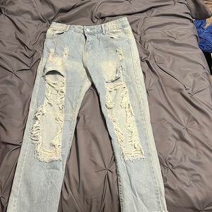 super ripped light blue jeans